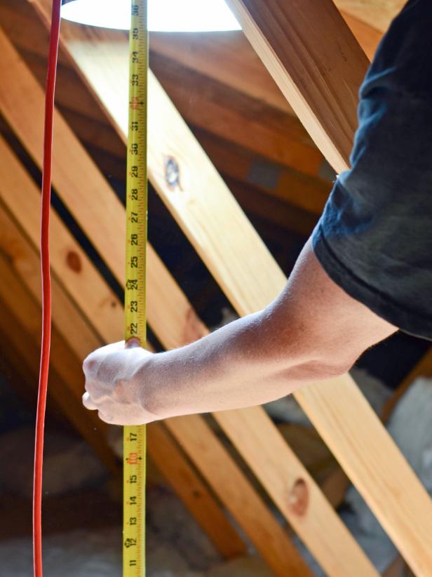 Use tape measure to determine height of gap between installed bottom (ceiling) tube and top (roof) tube.