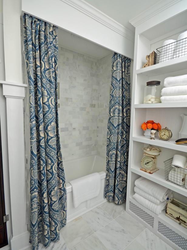 Traditional Bathroom With Marble Tiles and White Storage Shelf