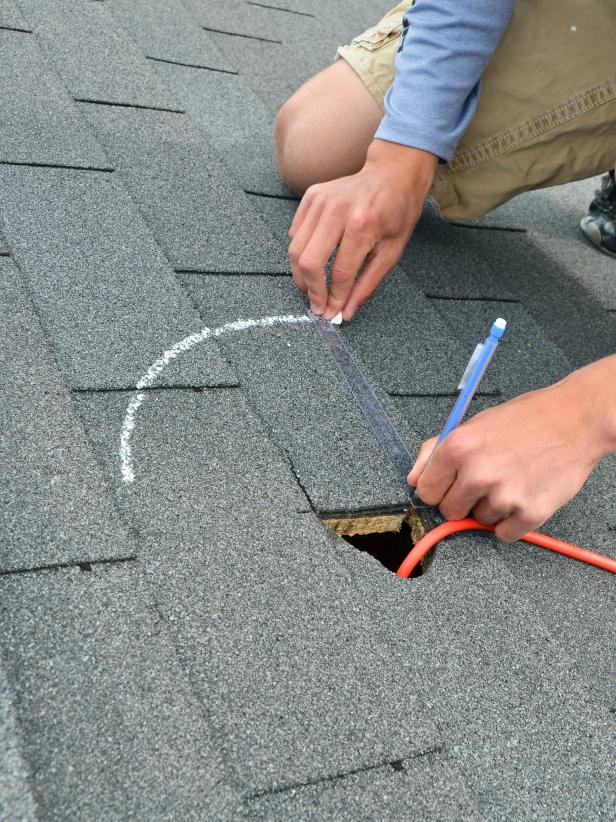 Climb up on roof using ladder placed in a sturdy location. Using center point marked with the large nail used in step 1, use template and a piece of chalk to draw circle.