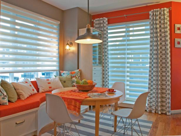 Vibrant and Eclectic Orange and White Dining Area