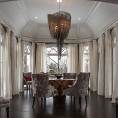 Grand Dining Room With Vaulted Ceiling, Dramatic Curtains and Chandelier
