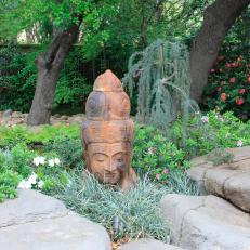 Asian Garden With Oversized Buddha Head Statue