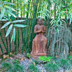 Asian Style Garden Featuring Buddha Surrounded by Bamboo