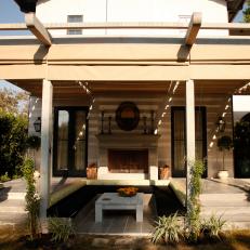 Backyard Patio With Pergola and Outdoor Fireplace