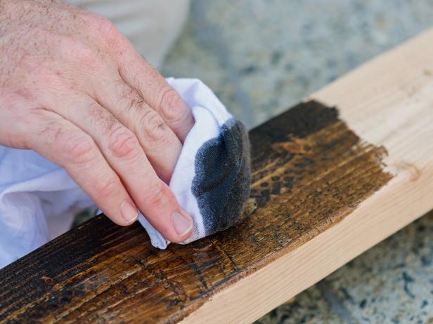 Rub a dark stain onto scrap wood pieces to make them look richer and more polished in the finished project.