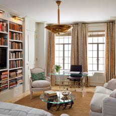 White Contemporary Living Space With Built-In Bookcase