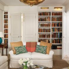 White Traditional Library With Cozy Sitting Area