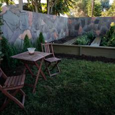 Backyard With Raised Garden and Bistro Dining Set