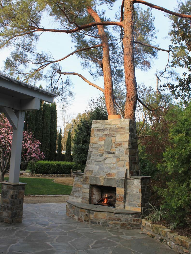 Mediterranean Stone Patio With Outdoor Stone Fireplace