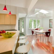 White Contemporary Open-Plan Kitchen and Dining Area