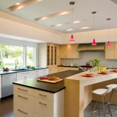 Neutral Contemporary Kitchen With Large Island and Red Pendant Lighting 