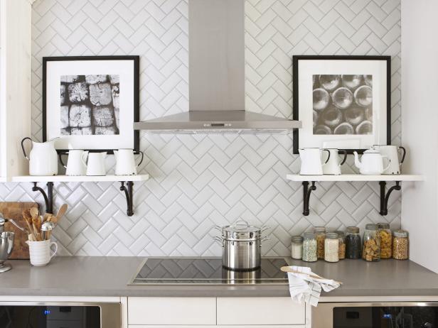 White kitchen with herringbone pattern subway tile backsplash