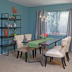 Blue Mid-Century Modern Dining Room With Neutral Velvet Chairs 