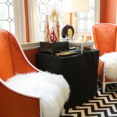 Orange Foyer With Upholstered Chairs and Chevron Area Rug