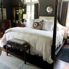 Bedroom with White Bed Linens and Dark Wood Two Poster Bed