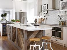 Kitchen with rustic wood island and marble countertop