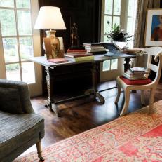 Traditional Desk Area With White Chair and Red Area Rug