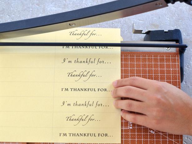 Use paper cutter or scissors to cut strips along template guidelines.