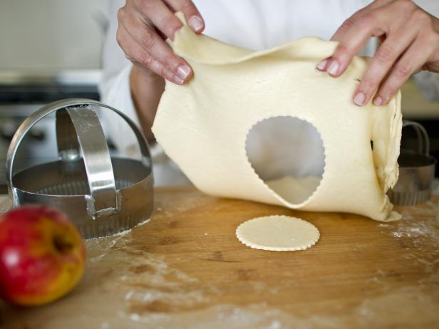 On new sheet of pastry, use 3-inch circular pastry cutter to cut out top crust. Tip: Use cutter with crimped edges for added decorative detail.