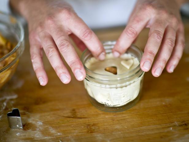 Place crust on top of filled jar. Use fingers or fork to tightly pinch edges of top crust to bottom crust to seal.