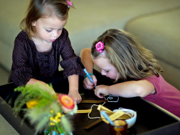 Two Little Girls Making a Thanksgiving Paper Chain