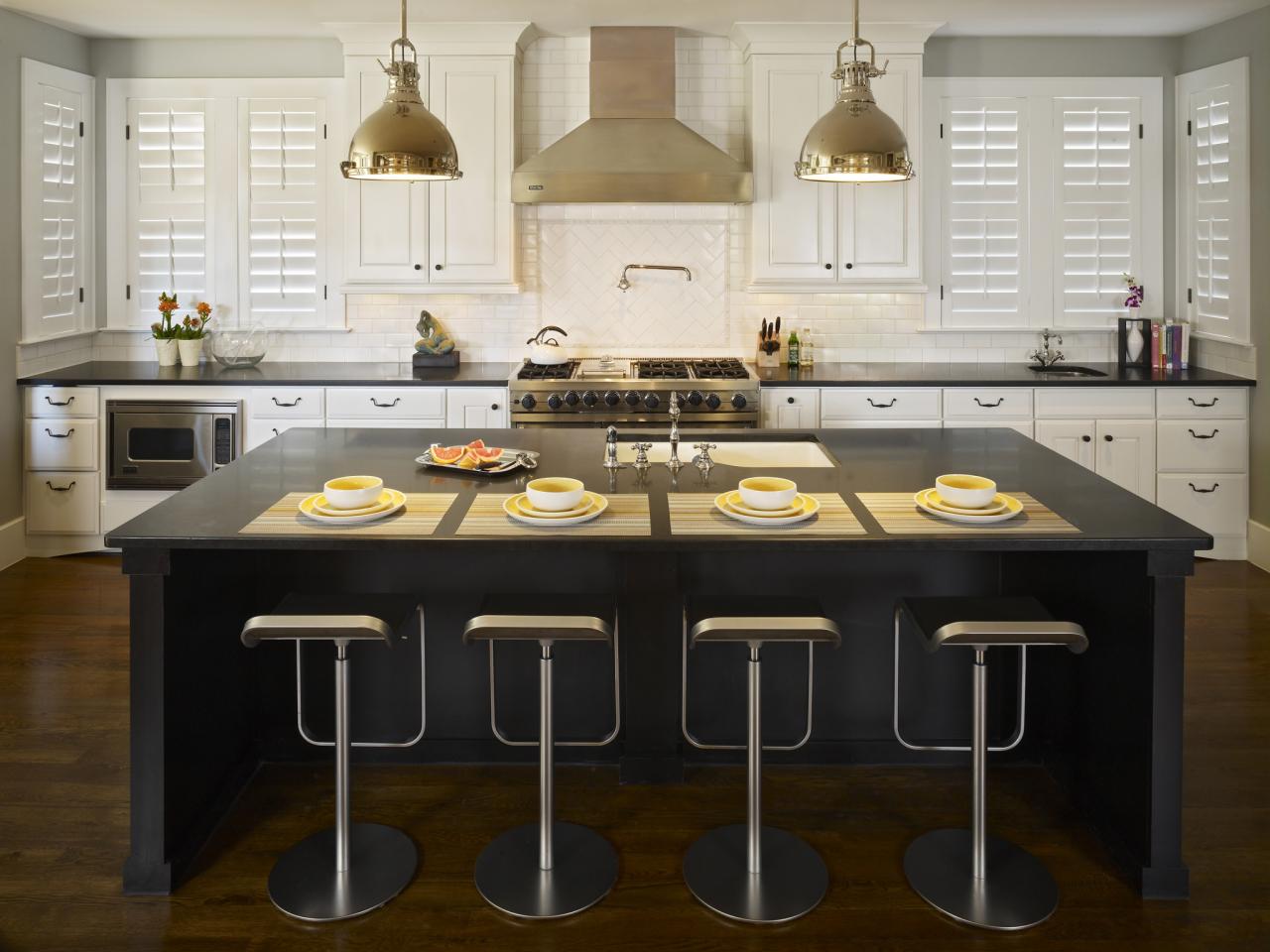 black kitchen island with butcher block top