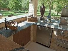 Neutral Outdoor Kitchen With Marble Countertops, Ornate Sink