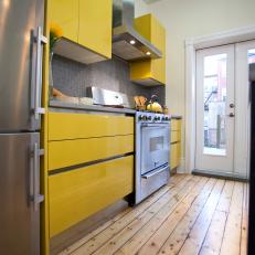 Modern Yellow Kitchen With Rustic Pine Floor