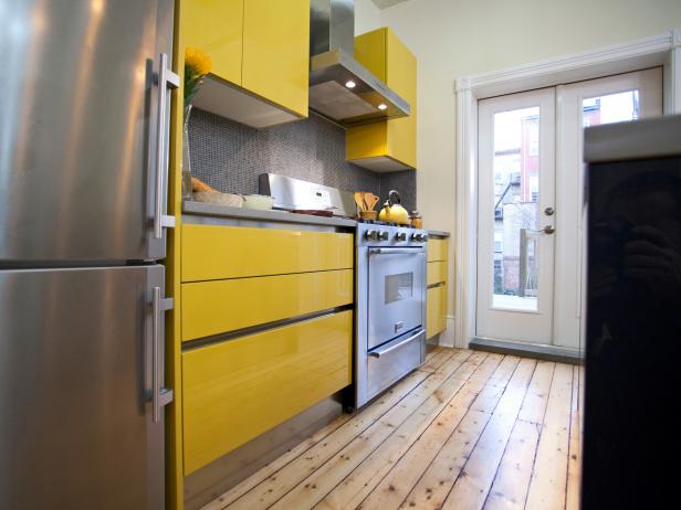 Modern yellow kitchen with stainless steel appliances