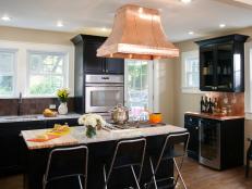 Traditional Kitchen With Black Cabinets and Copper Bar Countertop