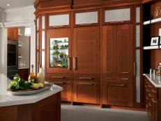 Wood Kitchen Cabinets With Hidden Refrigerator and Sleek Hardware