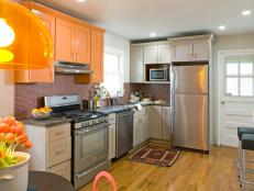 Neutral Transitional Kitchen With Set of Orange Cabinets
