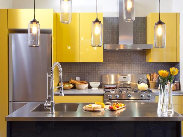 Yellow Cabinets And Metal Appliances.