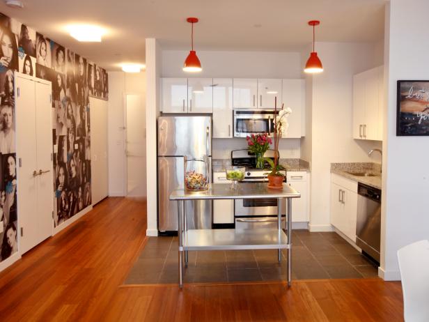 White Kitchen With Photo Wall, Two-Tiered Island & Red Pendant Lights