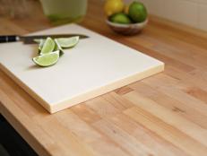 With a tight budget and timeline, homeowners went with butcher block as an in-stock countertop alternative to replace the dated white tile.