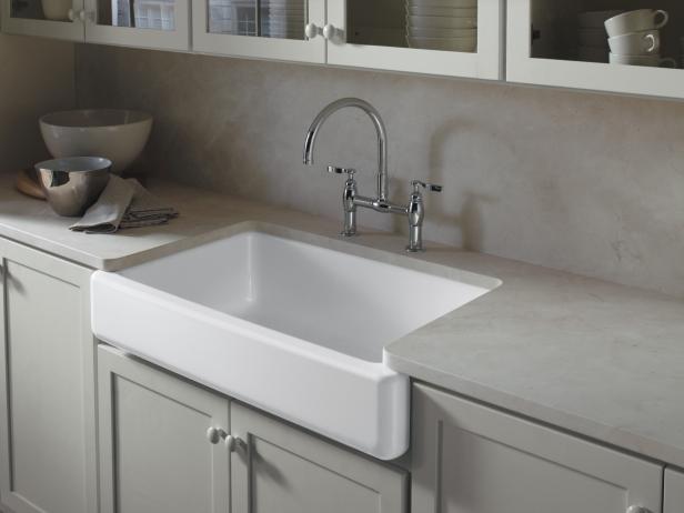 Kohler's apron-front cast-iron sinks (shown in white) come in a variety of colors, including new neutral tones Dune, a soft sandy shade, and Suede, a dark hue that pairs well with granite countertops. "Apron-front sinks have never gone out of style," says interior designer Christine Baumann. "They add a timeless focal point to any kitchen. From a practical standpoint, they're deep enough to hold large pots and platters for easier cleanup — a shorter person can even benefit from better access to the sink." Christine notes that because of their visual weight, apron-front sinks are best suited to medium-size or large kitchens. Image courtesy of Kohler