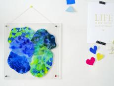 Fake the look of stained glass using crayons and wax paper. This modern take on a traditional technique creates free-form shapes that can easily be customized to match your space perfectly.
