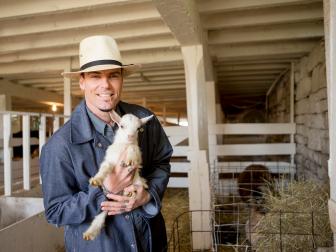Vanilla Ice holds a baby goat