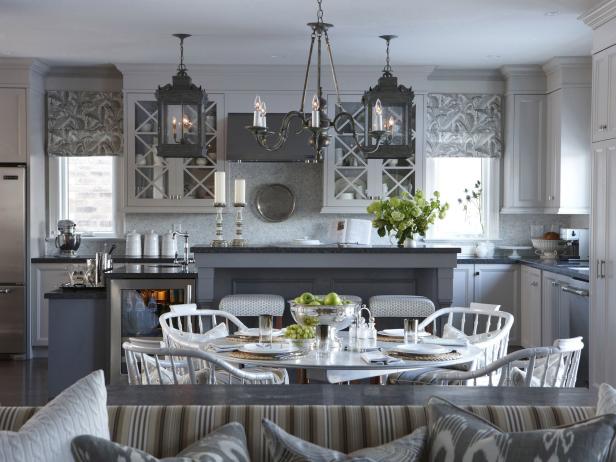 White Eat-in Kitchen With Gray Hues, Lantern Lighting and Tall Island