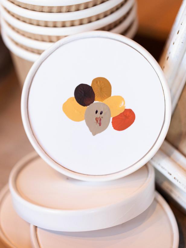 Keep the littlest Thanksgiving guests happily occupied with <a href=&quot;http://www.hgtv.com/handmade/thanksgiving-kids-craft-fingerprint-turkey/index.html&quot;>this fun craft</a> that allows them to personalize favor cups they can then fill with a custom sweet-and-salty snack mix.