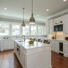 White Cottage Kitchen With Metal Pendants