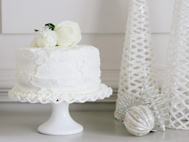 Cake With White Frosting Displayed on White Cake Stand