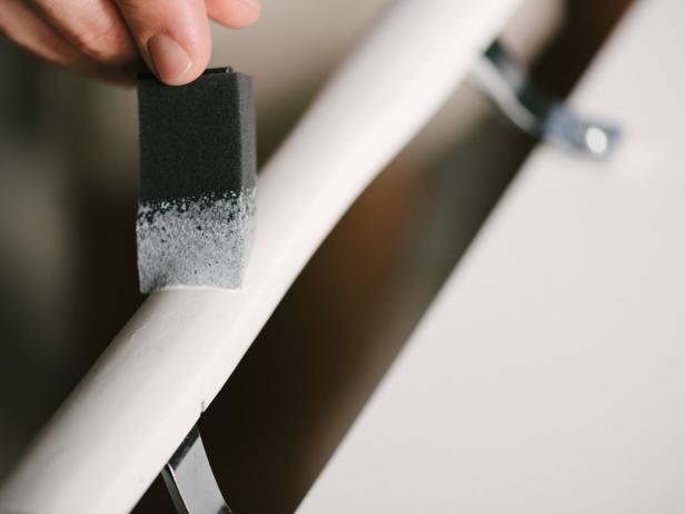 Depending on the style of patio door handle used, either fully update the paint or simply touch up any nicks using semigloss paint and foam paintbrush. Once dry, use the handle as a towel or linen holder.