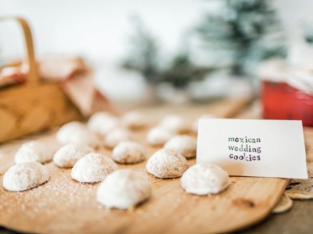 White cookies on wooden cutting board