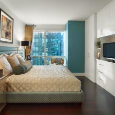 Blue Accents Add Coolness to White Bedroom 