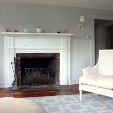White Fireplace and Armchair