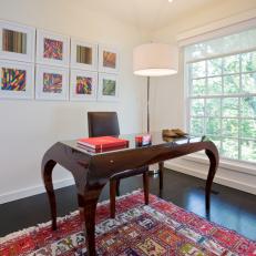 Eclectic Office With Colorful Rug and Dark Brown Desk