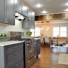 Transitional Kitchen With Gray Cabinets & Rustic Wood Beam