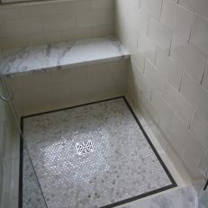 Marble Shower With Penny Tile Flooring Detail