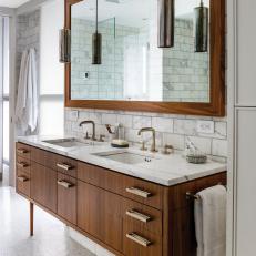 Modern Bathroom With Marble Walls and Warm Wooden Vanity